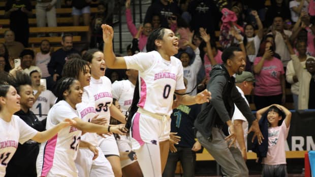 Birmingham Charter storms the court after the buzzer sounds, beating Westchester 55-50 in the City Section Open Division girls basketball finals at Pasadena City College on Saturday, Feb. 24, 2024.